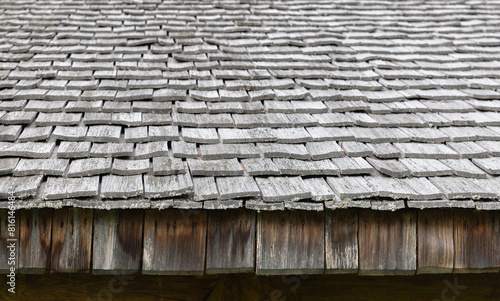 Old wooden house roof made of rough gray planks, background photo © evannovostro