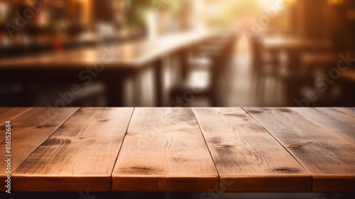 A rustic wooden table presented in the foreground with blurred lights in the background