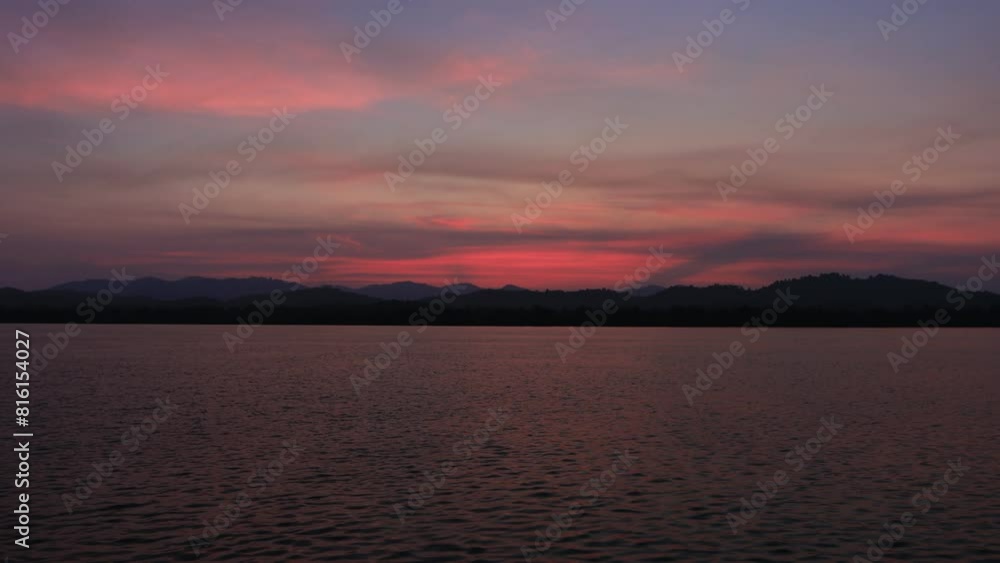 High angle video background with mountain scenery The river and the beautiful sunshine blurred onto the water surface in a golden light, the beauty of nature during the trip. High angle video background with mountain scenery The river and the beautiful sunshine blurred onto the water surface in a golden light, the beauty of nature during the trip.
