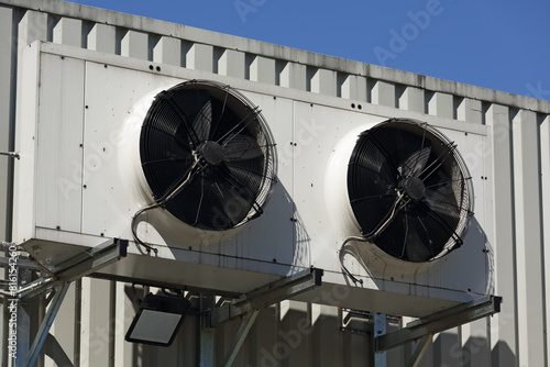 Two fans in a casing, a part of an air conditioner and the ventilation system