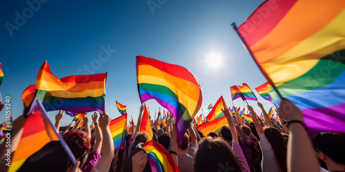 Crowd people with colorful lgbt flags outdoors at a parade, gay pride moth 