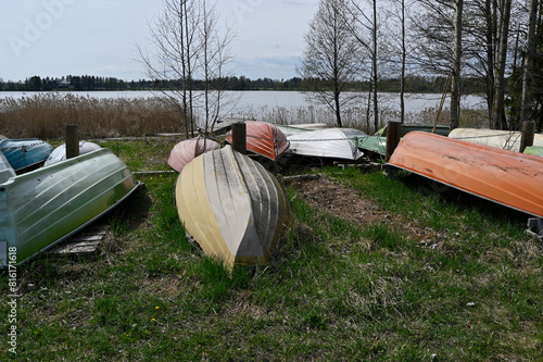 overturned boats on the lake shore