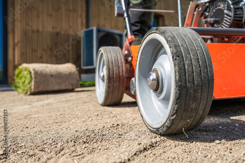 Wallpaper Mural A aerator sits stationary on a dirt backyard soil. Torontodigital.ca