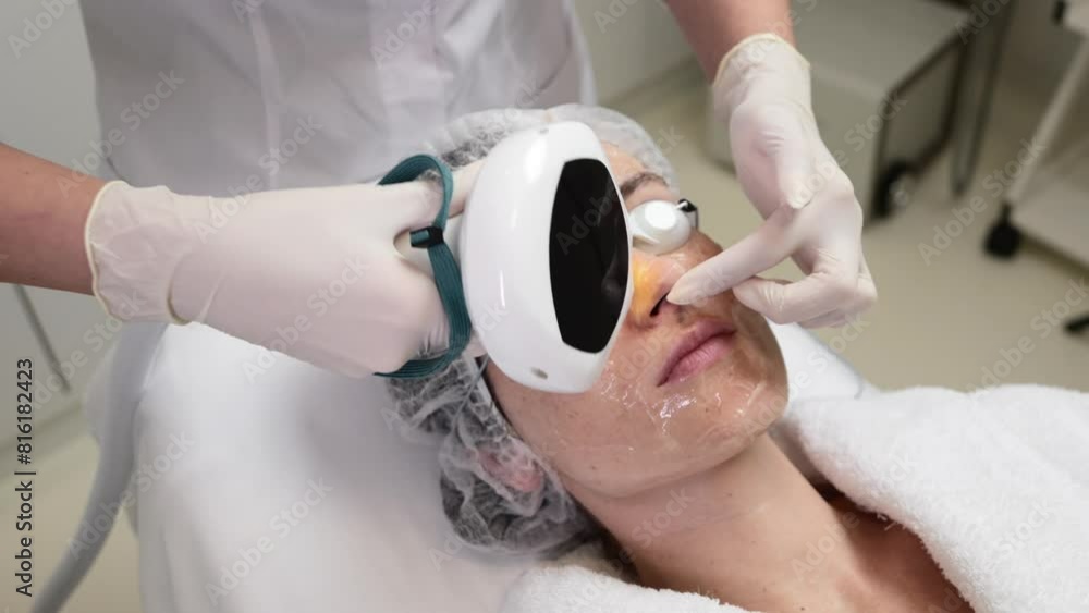 A woman receives IPL therapy in a beauty salon.