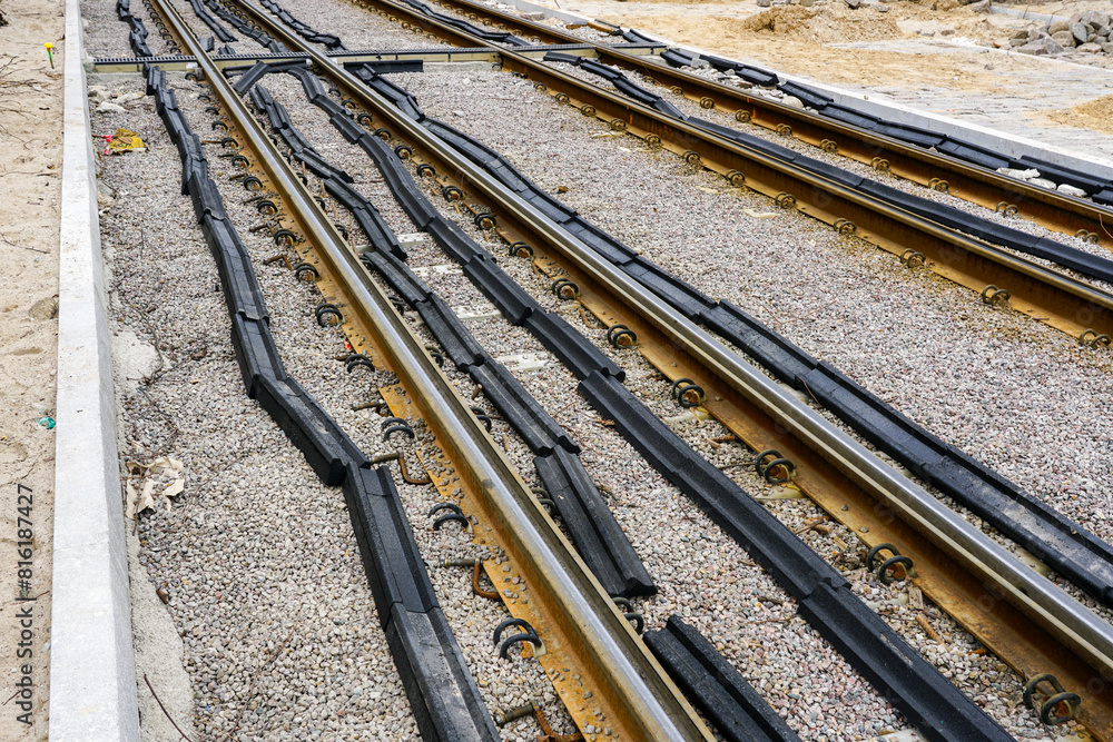 Attaching polyurethane pads to new tram rails to reduce vibration and noise emissions Attaching polyurethane pads to new tram rails to reduce vibration and noise emissions