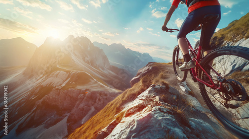 A biker taking a sharp turn on a narrow mountain trail, the bike leaning precariously with the dramatic backdrop of distant peaks. Dynamic and dramatic composition, with copy space photo
