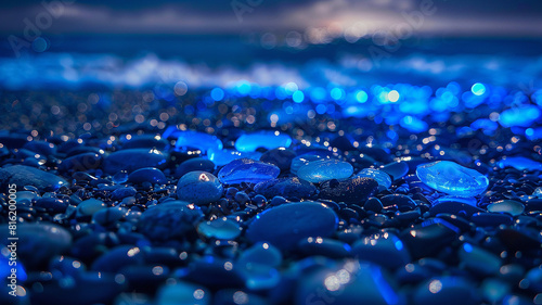 Transparent glowing colorful pebbles, Beach covered with fluorescent pebbles under the night sky 