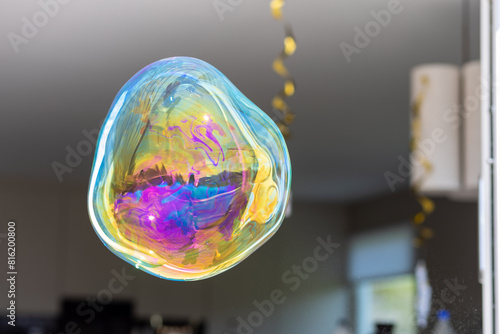 Принти на полотні A colourful soap bubble floating in mid-air