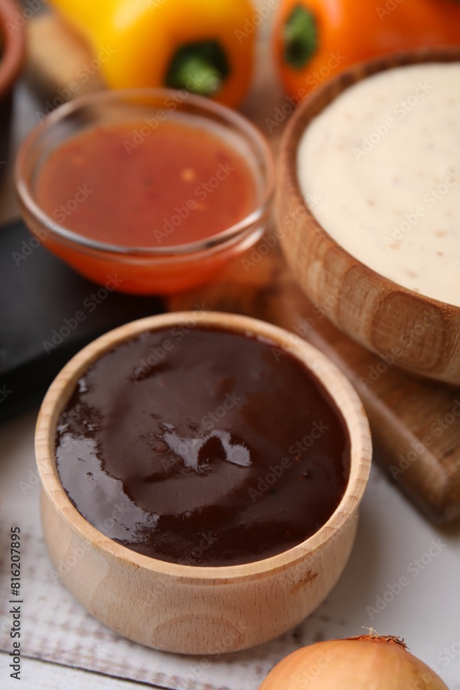 Fresh marinade in bowl on white wooden table, closeup