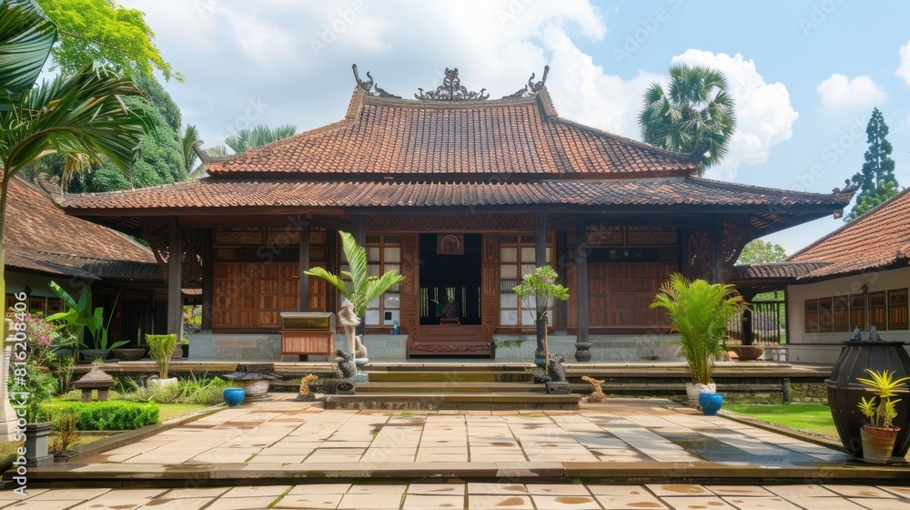 A large, red and white building with a tiled roof A large, red and white building with a tiled roof