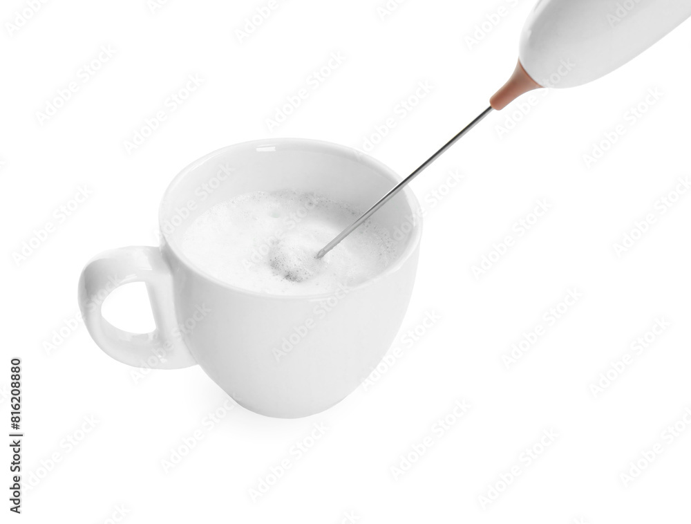 Whisking milk in cup with mini mixer (frother wand) isolated on white, closeup Whisking milk in cup with mini mixer (frother wand) isolated on white, closeup