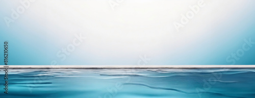 A serene view of a calm water surface with a clear sky background. Panorama with copy space.