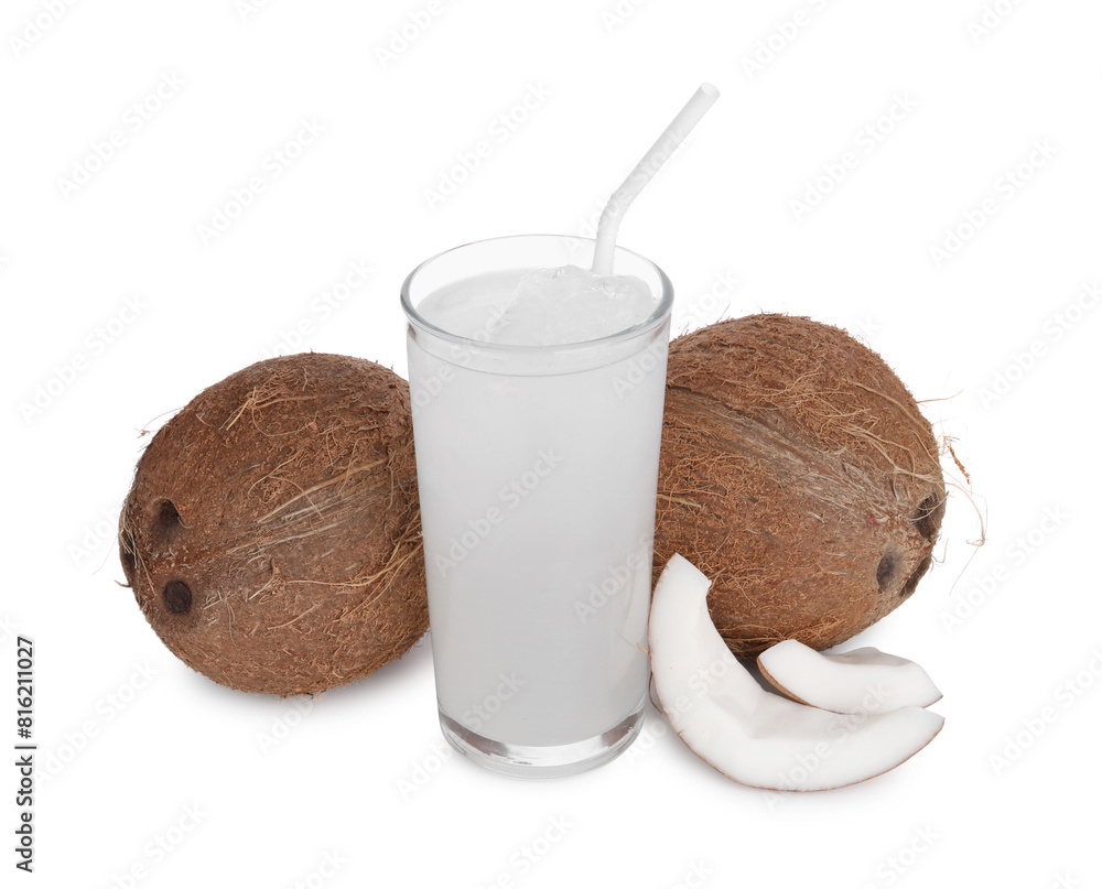 Glass of coconut water, ice cubes and nuts isolated on white Glass of coconut water, ice cubes and nuts isolated on white