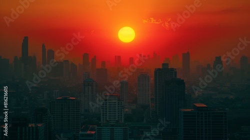 Cityscape with big sun and sunset on center between building at evening
