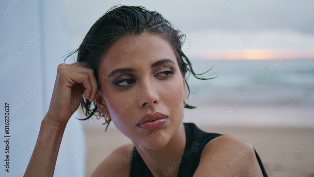 Portrait sexy woman posing cloudy shore. Attractive fashion model looking camera