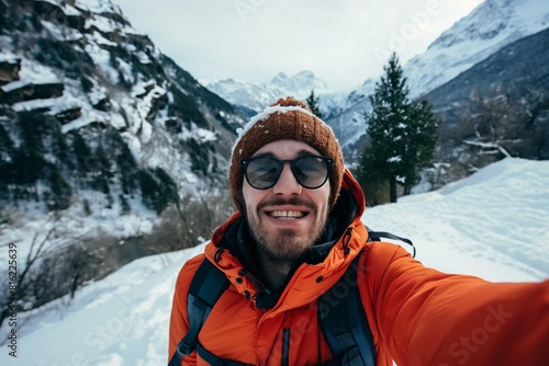Traveler selfie in snowy mountains