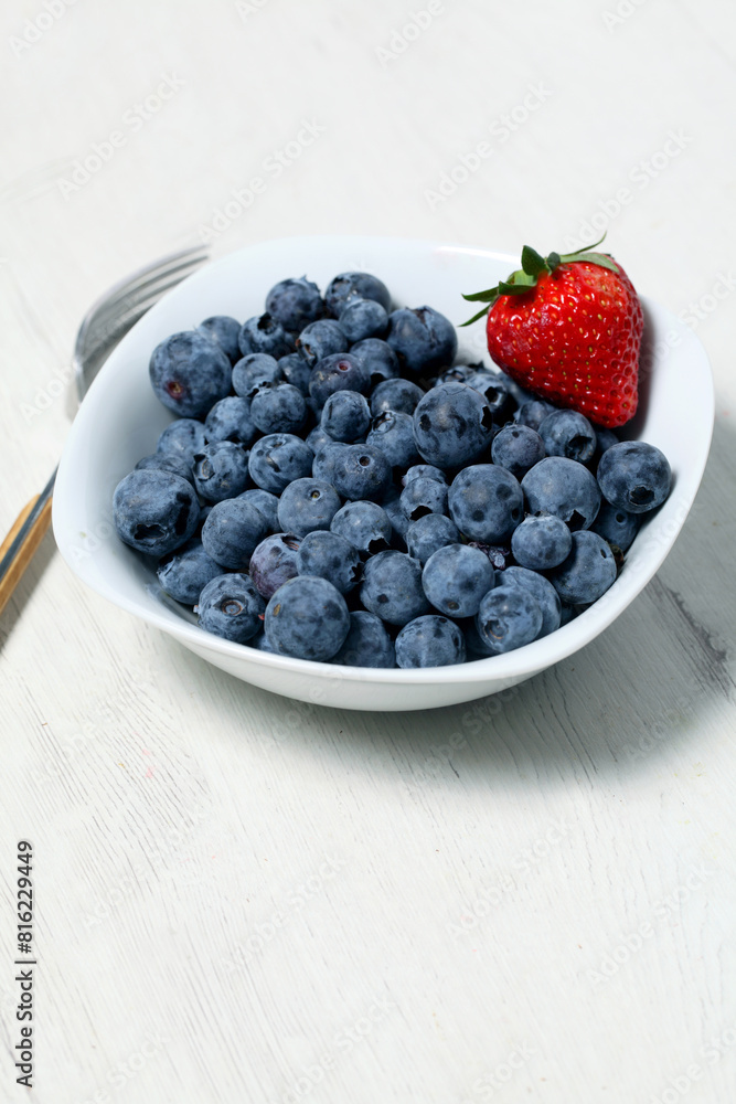 White bowl with fresh blueberries seen from above White bowl with fresh blueberries seen from above