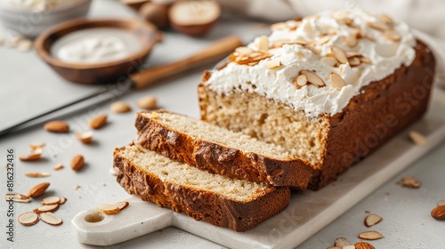 Sliced almond bread topped with whipped cream. Studio food photography. Dessert and baking concept