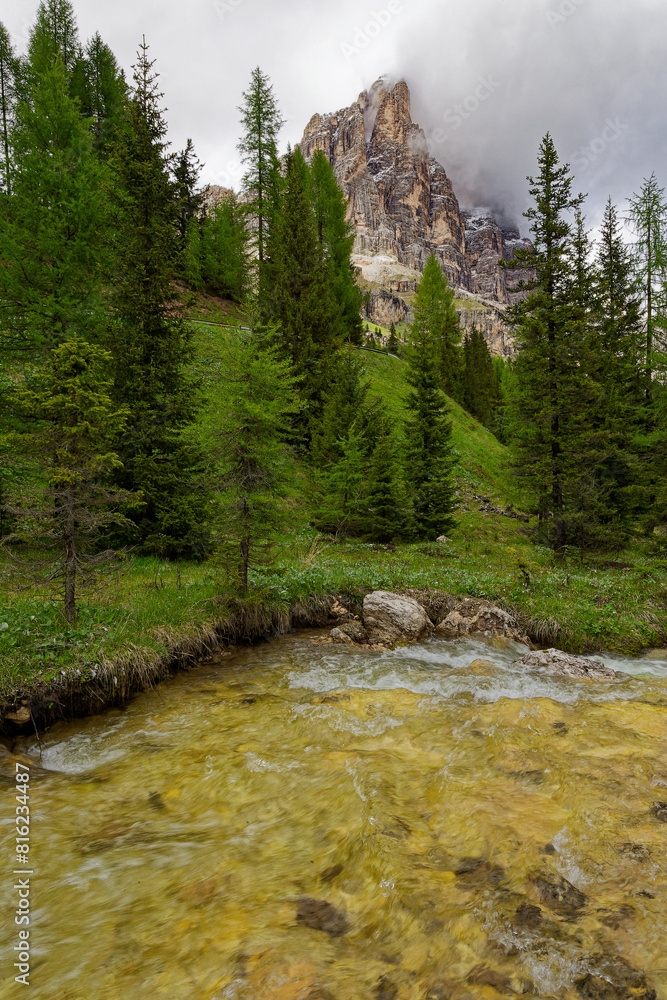 Alpine scenes of the Dolomite mountains Italy. With lush green pastures and snow topped mountain vistas. Mountain lake Laghi dei Piani near Tre Cime in Dolomites. Panorama of beautiful mountains. Alpine scenes of the Dolomite mountains Italy. With lush green pastures and snow topped mountain vistas. Mountain lake Laghi dei Piani near Tre Cime in Dolomites. Panorama of beautiful mountains.