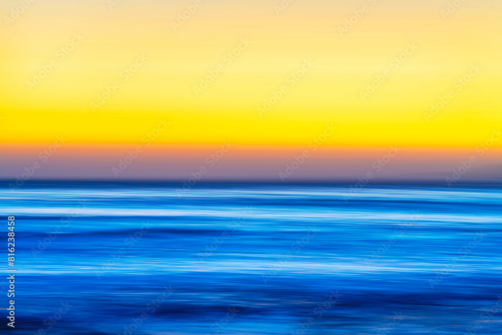 Sunset over the ocean, water with long exposure Sunset over the ocean, water with long exposure