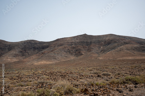 Arid, volcanic landscape of the southern side of Jandia Nature Reserve, Jandia Peninsula, Fuerteventura, Spain