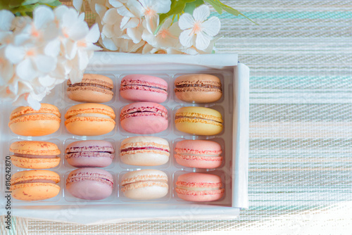 Macaron, typical French sweet, homemade macaron in different flavors and colors.