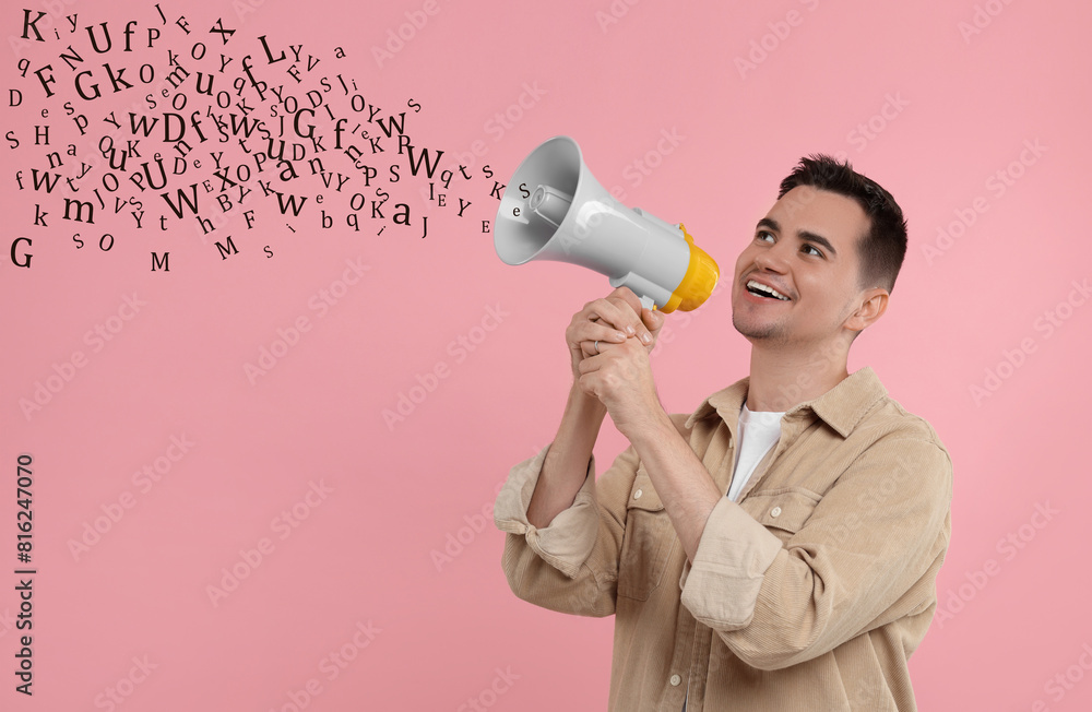 Man using megaphone on pink background. Letters flying out of device Man using megaphone on pink background. Letters flying out of device