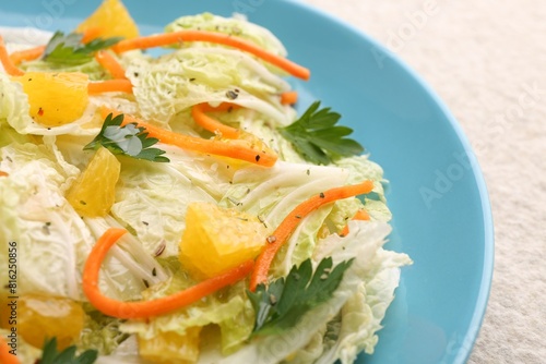 Tasty salad with Chinese cabbage on table, closeup