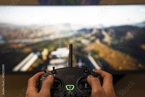 Εκτύπωση καμβά Close-up shot of the fpv controler on the background of the screen with a flight