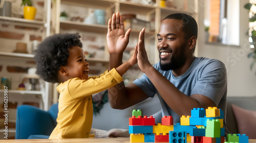 Happy young african American father and little ethnic son give high five playing together with bricks at home overjoyed biracial dad and small boy child celebrate kid achievement learn : Generative AI