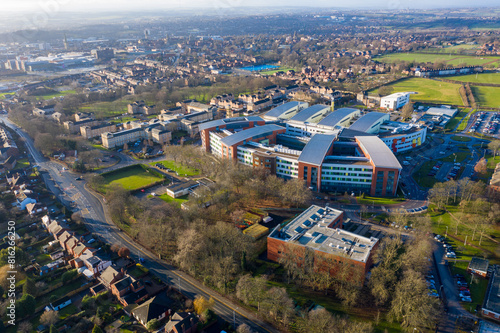 Aerial drone photo of main building of the Pinderfields Hospital, located in Wakefield West Yorkshire in the UK showing a Birds Eye view of the hospital grounds and car park in the winter time photo