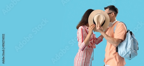 Young couple kissing behind...