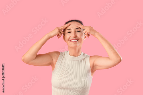 Smiling mature woman practi...