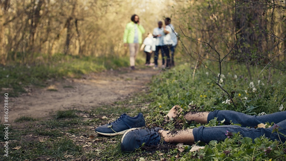 Rescuers group finding murdered barefoot victim in the forest, scared people calling the police. Mysterious horror manslaughter in the woods, civilians found a dead body, grim murder. Camera B. Rescuers group finding murdered barefoot victim in the forest, scared people calling the police. Mysterious horror manslaughter in the woods, civilians found a dead body, grim murder. Camera B.