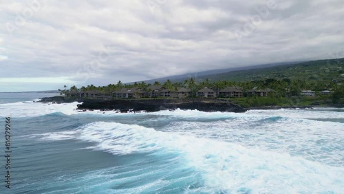 waves in the ocean on a rocky black beach in Hawaii Big Island 4k