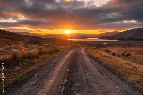 road leading towards sunset behind the hills. High quality photo