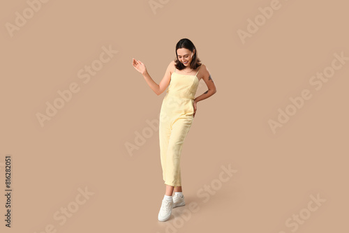 Beautiful young woman in st...