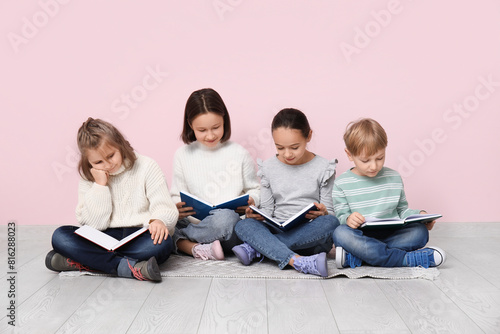 Little children reading boo...