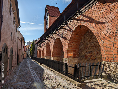 Old medieval narrow street in Riga, Latvia. Medieval Jacobs barracks.