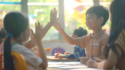 Pupil boy hi five with asian teacher in classroom at elementary school Student boy study in primary school Children writing notes in classroom Education knowledge successful teamwork c : Generative AI photo