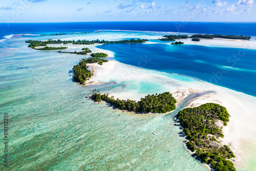 Aerial shot of Palmyra Atoll with islands, reef, lagoon, causeways and surrounding ocean photo