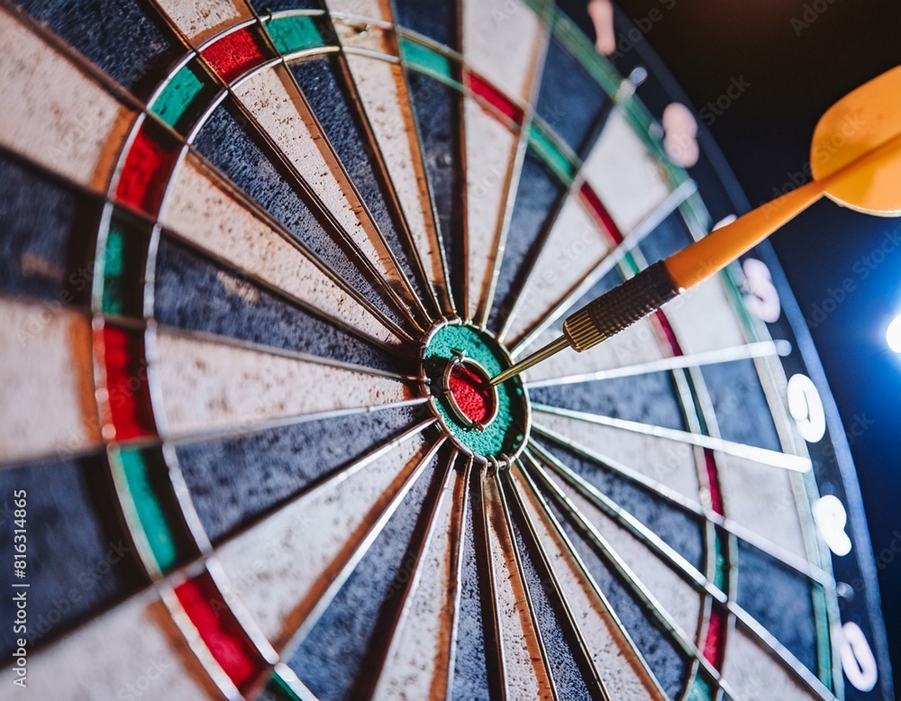 Close-up of a dart hitting the bullseye on a dartboard, showcasing accuracy and precision. Close-up of a dart hitting the bullseye on a dartboard, showcasing accuracy and precision.