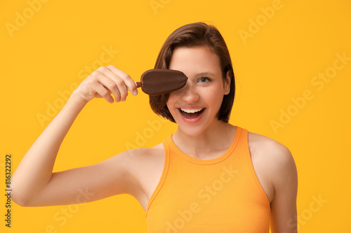 Happy young woman holding a...