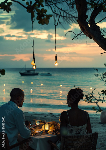 Elegant beach dinner for black couple on holiday  