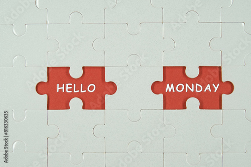 Monday started. HELLO MONDAY words on puzzle.