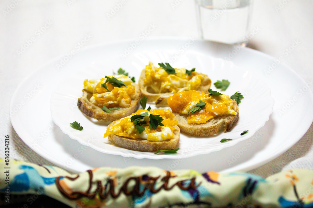 Healthy breakfast, toast with avocado, eggs and tomatoes