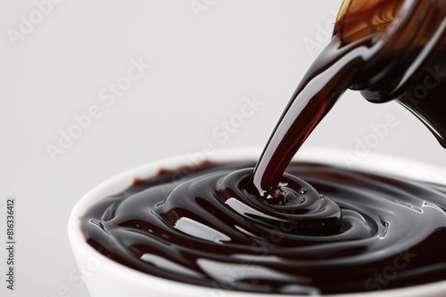 Pouring Chocolate Syrup into a Cup