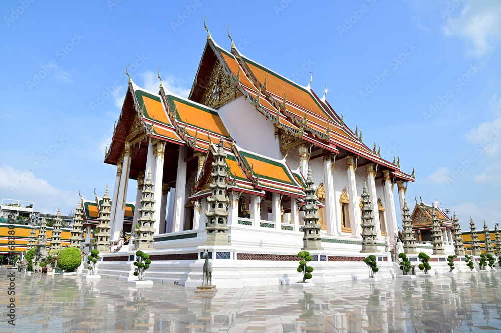 BANGKOK, THAILAND - May 15, 2024: View of Wat Suthat Thepwararam Ratchaworamahawihan with blue sky background, Phra Nakhon, Bangkok, Thailand.