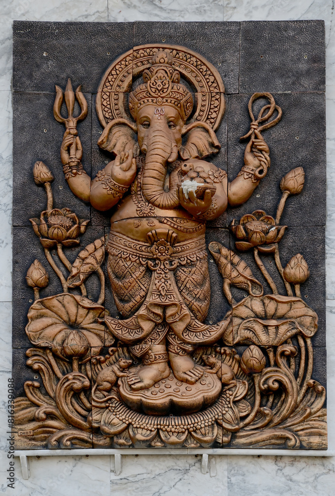 Closeup of The statue of the Ganesha on the wall of the temple in Bangkok, Thailand. Closeup of The statue of the Ganesha on the wall of the temple in Bangkok, Thailand.