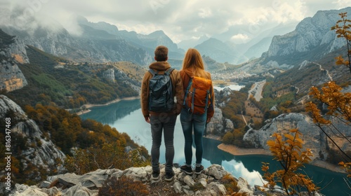 Mountain Viewpoint: Couple Admiring Breathtaking Landscape - Active Lifestyle Nature Concept photo